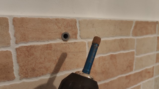 Photo of a cat named Shakespeare sitting on a window sill